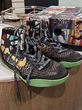 Nike Kids Black High-Top Sneakers with Gold Swoosh and Green Soles